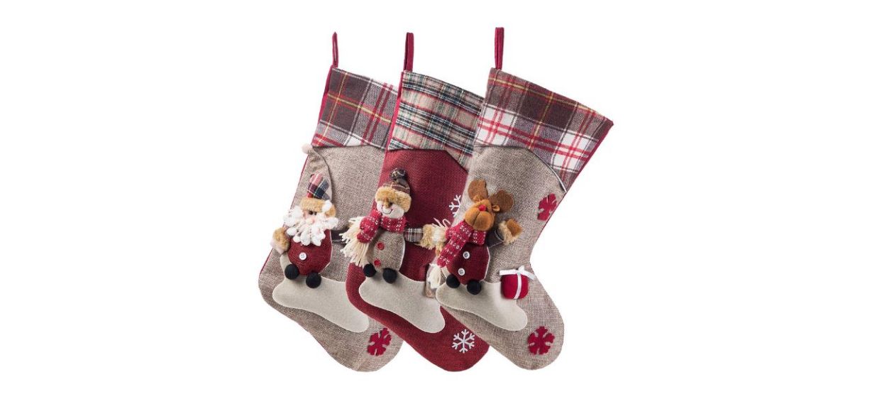 3 red and beige Christmas stockings, one with a design of Santa, one with a reindeer and one with a snowman  3 red and beige Christmas stockings, one with a design of Santa, one with a reindeer and one with a snowman