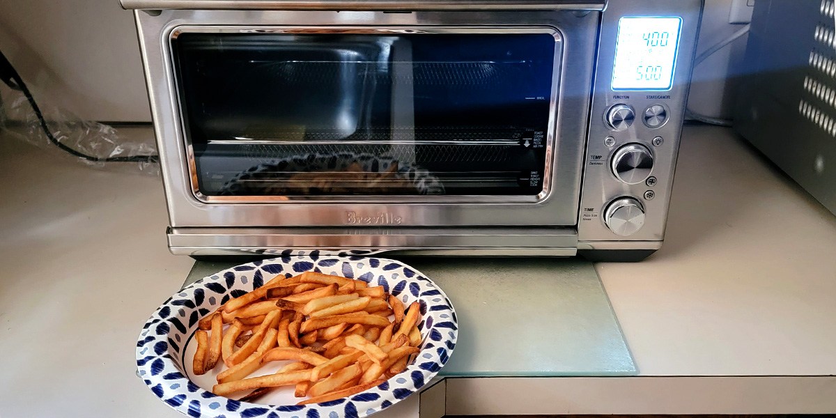 Plate of fries in front of Breville Smart Oven Air Fryer Plate of fries in front of Breville Smart Oven Air Fryer