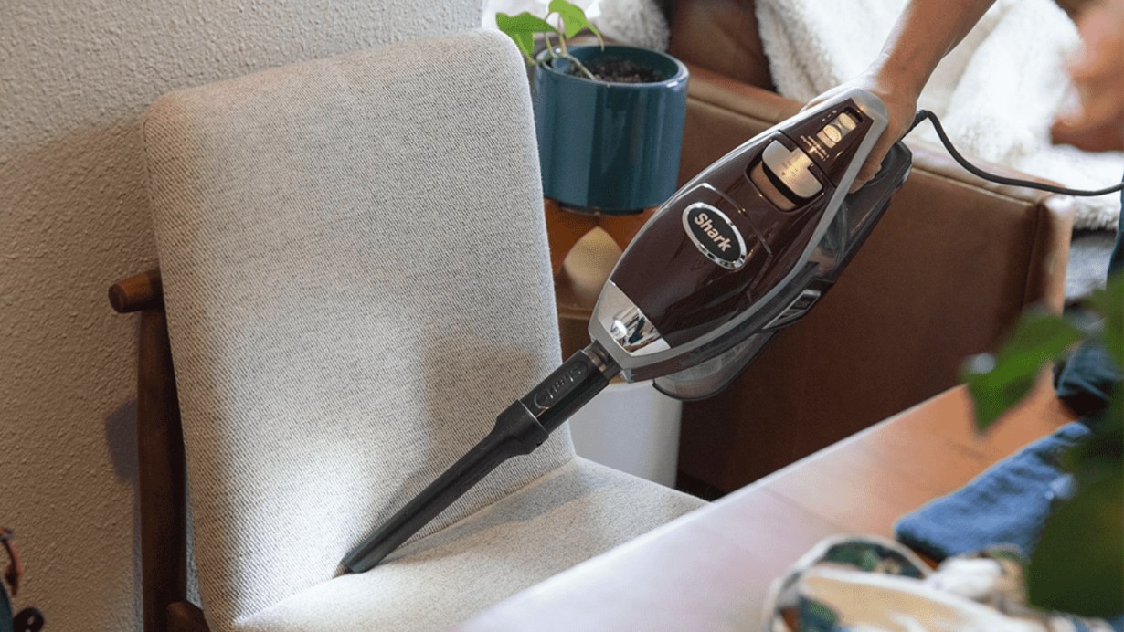 Using Shark HV322 Rocket Deluxe Pro Corded Stick Vacuum on a chair Using Shark HV322 Rocket Deluxe Pro Corded Stick Vacuum on a chair