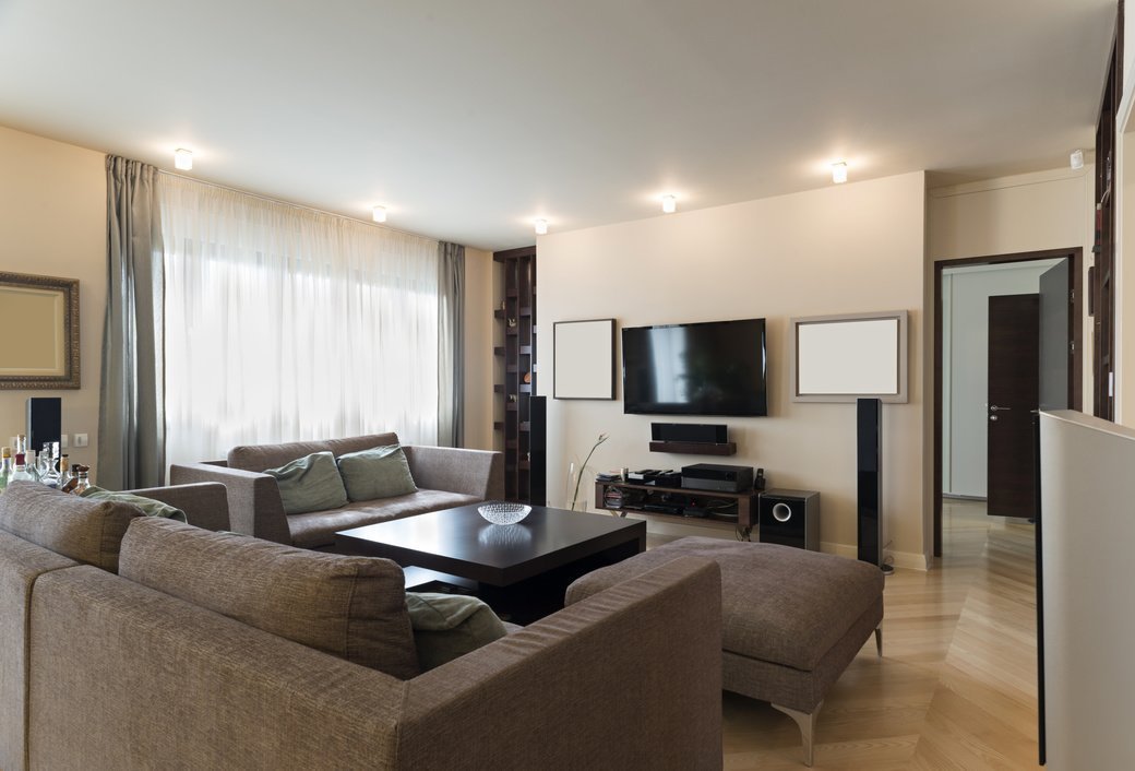 Living room with TV and soundbar on the wall