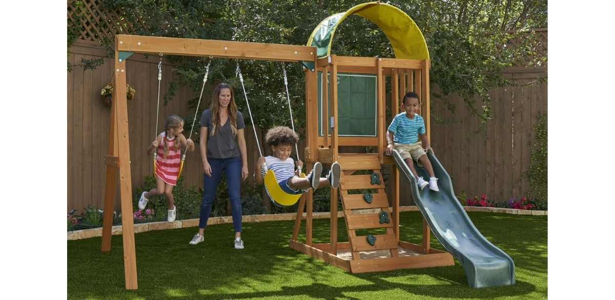 KidKraft Ainsley Wooden Outdoor Swing Set with Slide and Rock Wall