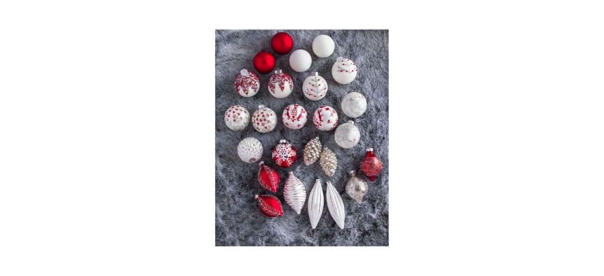 Balsam Hill Nordic Frost Ornament Set, red and white, on gray fuzzy blanket