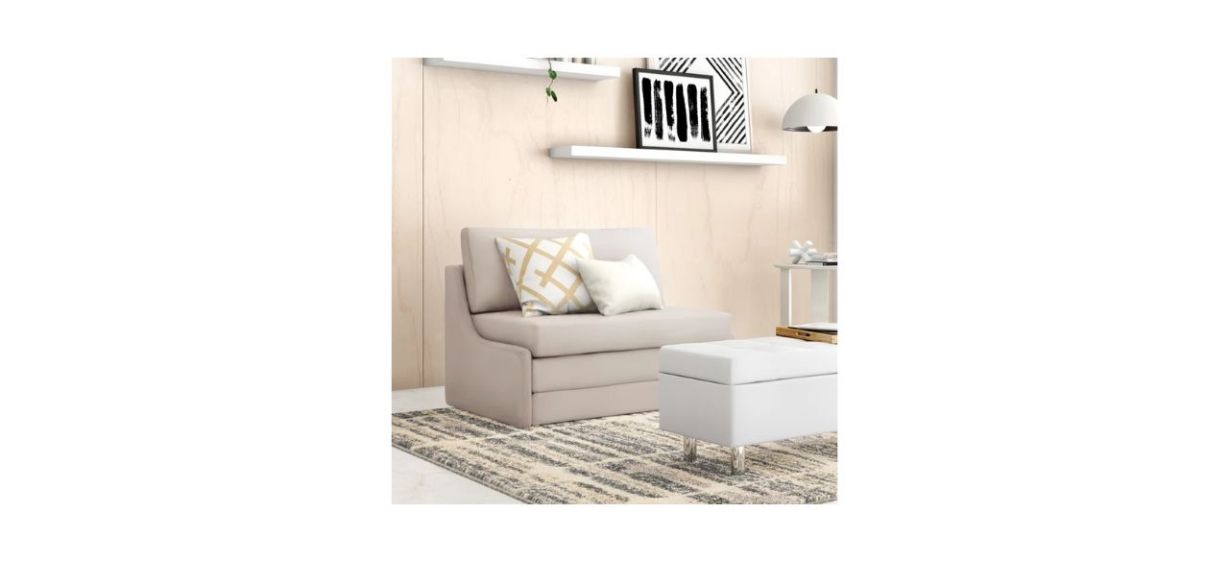 A beige, two-seater loveseat that pulls out into a small bed