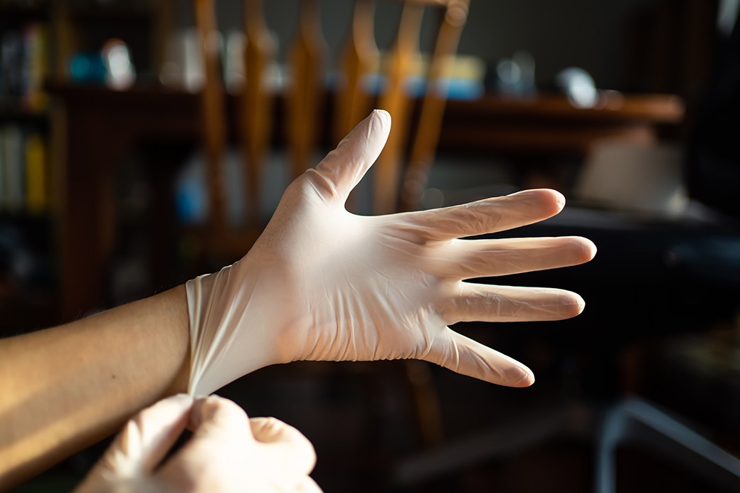 Person putting on gloves