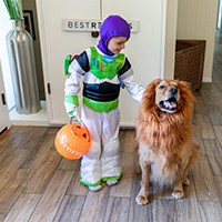a kid in Halloween costumes